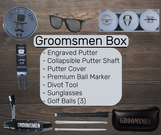 Groomsmen box contents including engraved putter, sunglasses, golf balls, Premium Ball Marker, Divot Tool, Putter Cover and more on a wooden surface.
groomsmen golf gift
personalized putter set
wedding party golf gift
custom golf gift for men
engraved groomsmen gift
last minute wedding gift
golf gift box for groomsman
bachelor party golf gift
groom gift for groomsmen
golf accessories gift set