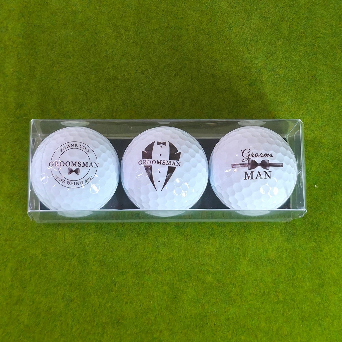 Three golf balls with 'Groomsman' text in a clear packaging on a green background
groomsmen golf gift
personalized putter set
wedding party golf gift
custom golf gift for men
engraved groomsmen gift
last minute wedding gift
golf gift box for groomsman
bachelor party golf gift
groom gift for groomsmen
golf accessories gift set