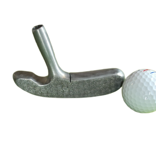 Golf putter and golf ball on a white background