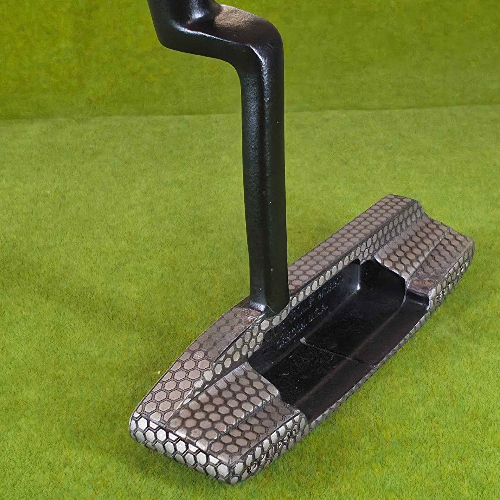 Cleaning tool with bristle brush on a green surface