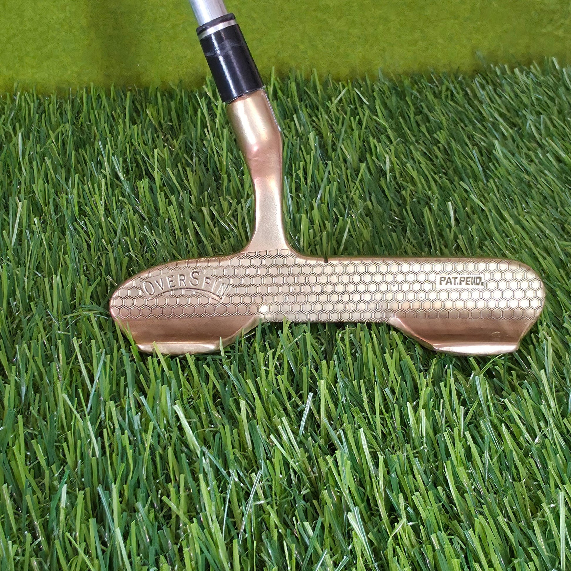 Golf putter on artificial grass