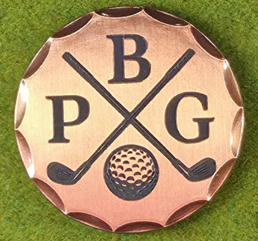 Golf-themed metal badge with 'PBG' initials on a green grass background