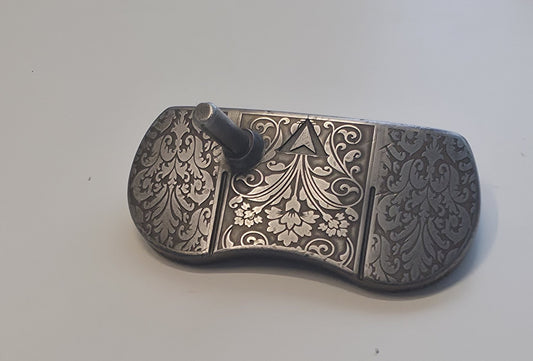 Custom engraved golf putter head with ornate floral and scrollwork design in antique brushed metal finish. Features deep engraving for durability, luxury artisan detailing, and an elegant symmetrical pattern. Perfect for golfers seeking a unique club, golf collectors, or as a personalized gift with initials, logos, or dates added. A blend of performance and craftsmanship designed to stand out on the green or in a golf display collection.