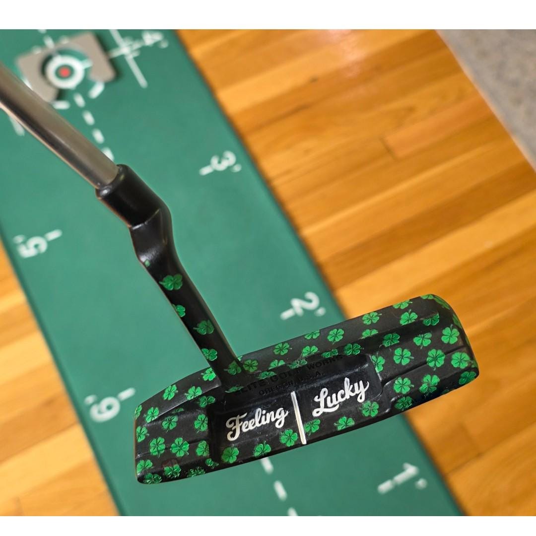 Custom black golf putter with green shamrock clover pattern, "Feeling Lucky" engraving, white alignment line, and Elite Golf Works USA branding — novelty St. Patrick’s Day golf gift for Irish golf lovers and collectors

custom golf putter

black putter head

green shamrock / clover pattern

“Feeling Lucky” engraving

alignment line

Elite Golf Works USA

St. Patrick’s Day golf gift

novelty golf club

Irish golf lovers

collectors