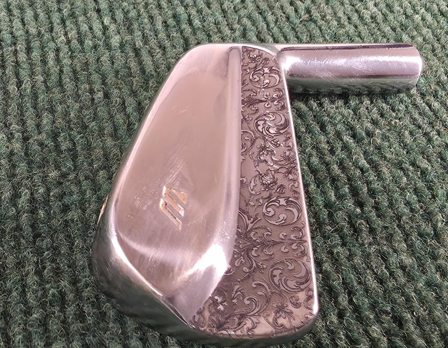 Custom engraved Mizuno 4 Iron with detailed floral scroll pattern. Unique golf club for players, collectors, and as a personalized golf gift. Perfect for Father’s Day, birthdays, weddings, or retirement. Durable steel iron designed for performance with a custom engraved finish. A one-of-a-kind Mizuno golf iron combining artistry and function, making it a standout piece for golf enthusiasts. engraved golf iron
custom mizuno iron
golf gift for him
engraved 4 iron custom golf club unique golf gift