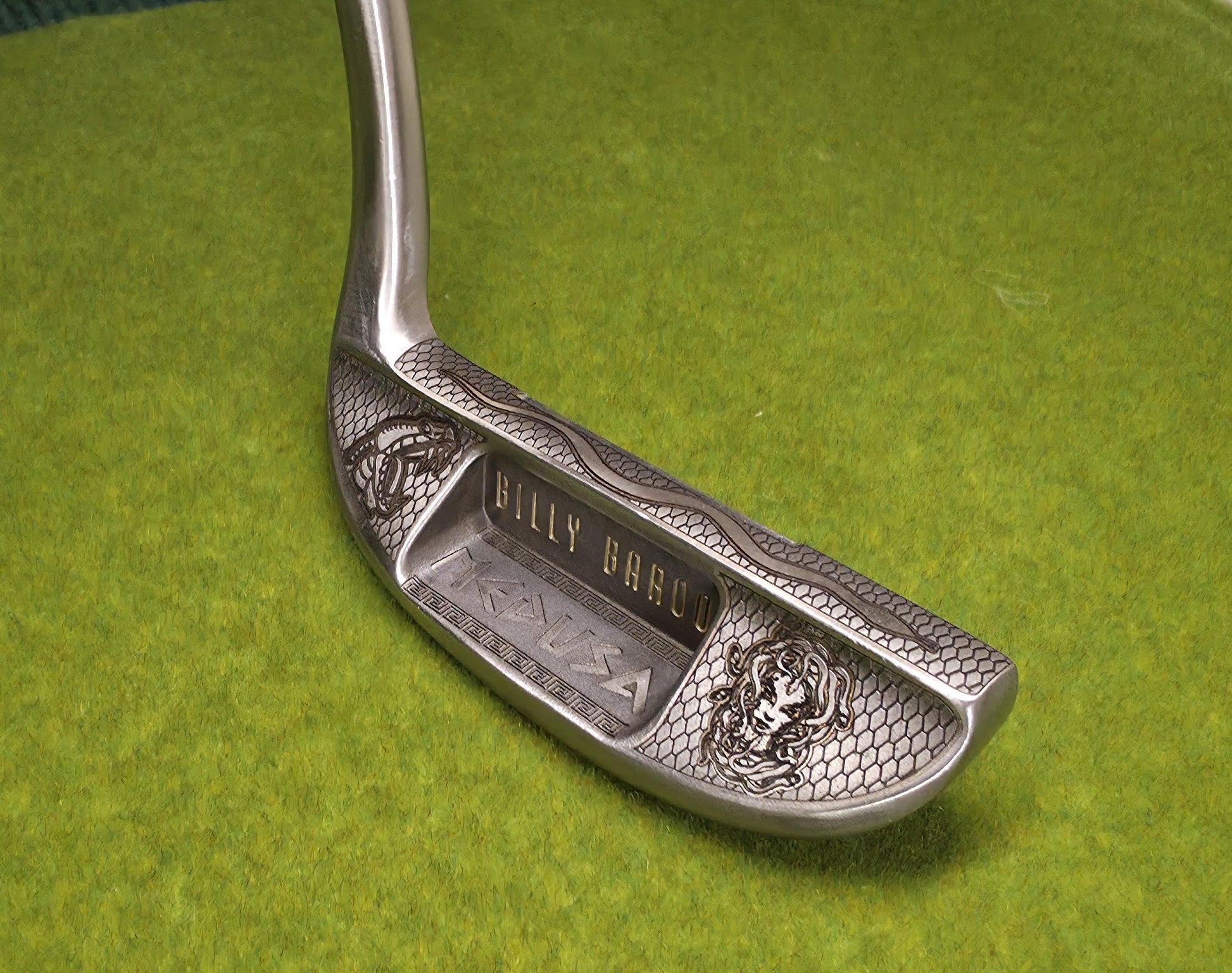 Medusa-inspired engraved Ray Cook Billy Baroo putter with serpent scales, snake engraving, and detailed Medusa face design. Unique mythology-themed golf club that can be played or displayed as a collector’s piece. Custom laser engraved putter ideal for golf enthusiasts, mythology fans, and collectors. Perfect gift for Father’s Day, groomsmen, birthdays, or golf lovers who want a one-of-a-kind club with both style and attitude. medusa golf putter ray cook billy baroo engraved golf putter