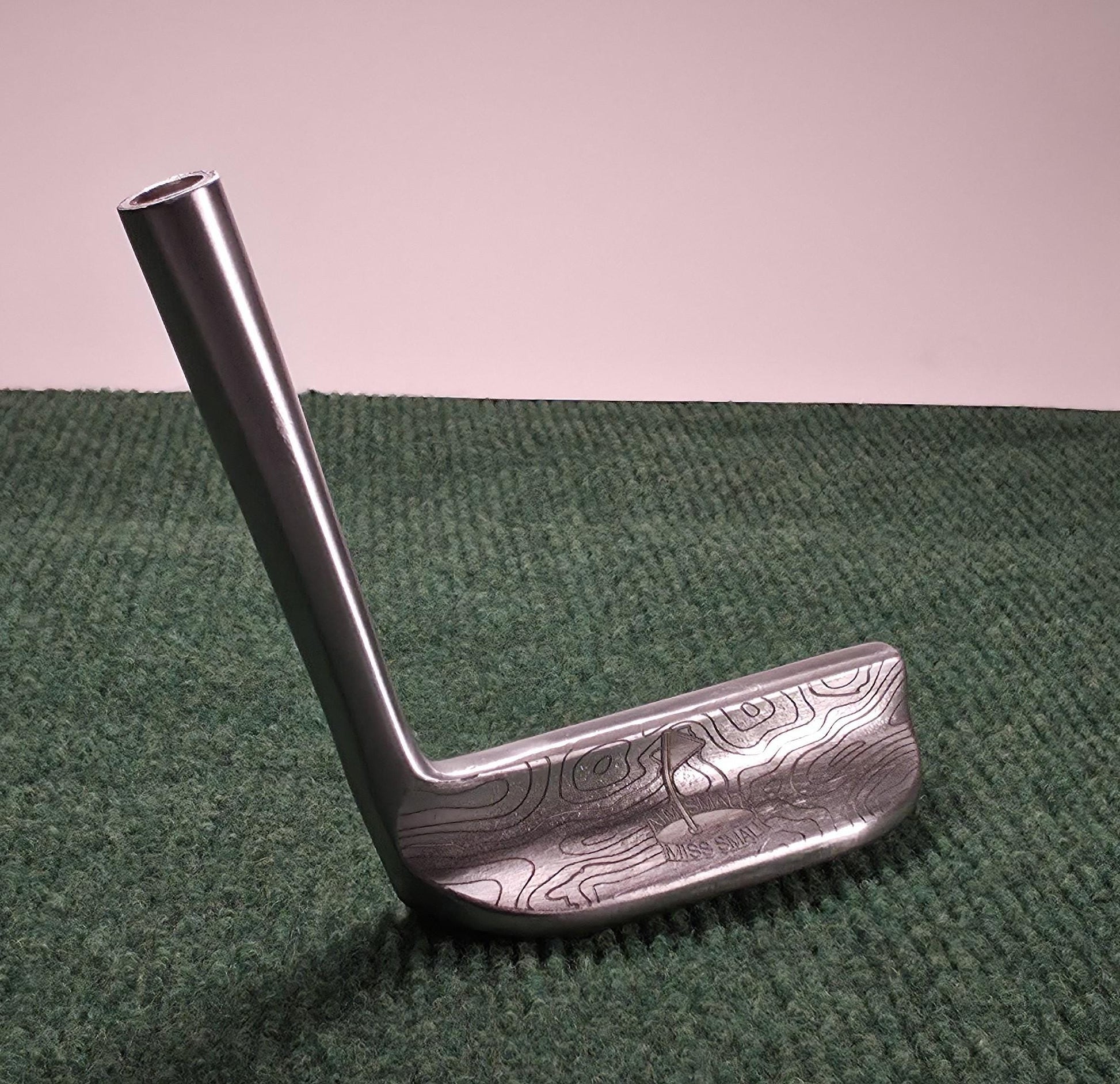 Custom engraved Cleveland Classic putter with topographic map design and “Aim Small Miss Small” phrase. Laser-engraved golf putter for players, collectors, and as a personalized golf gift. Features detailed circle pattern on the putter face for style and performance. Perfect for Father’s Day, birthdays, weddings, or retirement. A unique, functional Cleveland putter that combines artistry with accuracy. engraved golf putter cleveland golf club custom golf putter aim small miss small unique golf