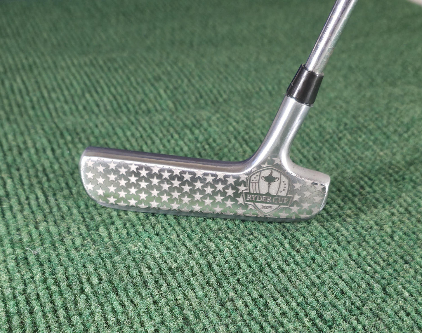 Custom engraved Spalding Cash-In putter inspired by the 2025 Ryder Cup. Features stars, eagle crest, and repeating Ryder Cup text pattern. Vintage-style engraved golf putter for collectors, players, and gift-giving. Perfect for Ryder Cup fans, golf history enthusiasts, or as a personalized golf gift. Durable steel putter head with laser engraving, combining artistry and performance in a one-of-a-kind golf collectible ryder cup putter spalding golf putter engraved golf club custom golf putter