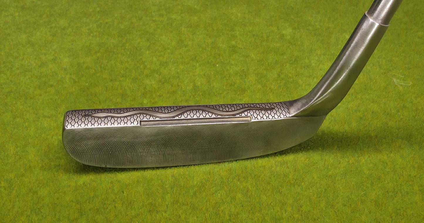 Medusa-inspired engraved Ray Cook Billy Baroo putter with serpent scales, snake engraving, and detailed Medusa face design. Unique mythology-themed golf club that can be played or displayed as a collector’s piece. Custom laser engraved putter ideal for golf enthusiasts, mythology fans, and collectors. Perfect gift for Father’s Day, groomsmen, birthdays, or golf lovers who want a one-of-a-kind club with both style and attitude. medusa golf putter ray cook billy baroo engraved golf putter