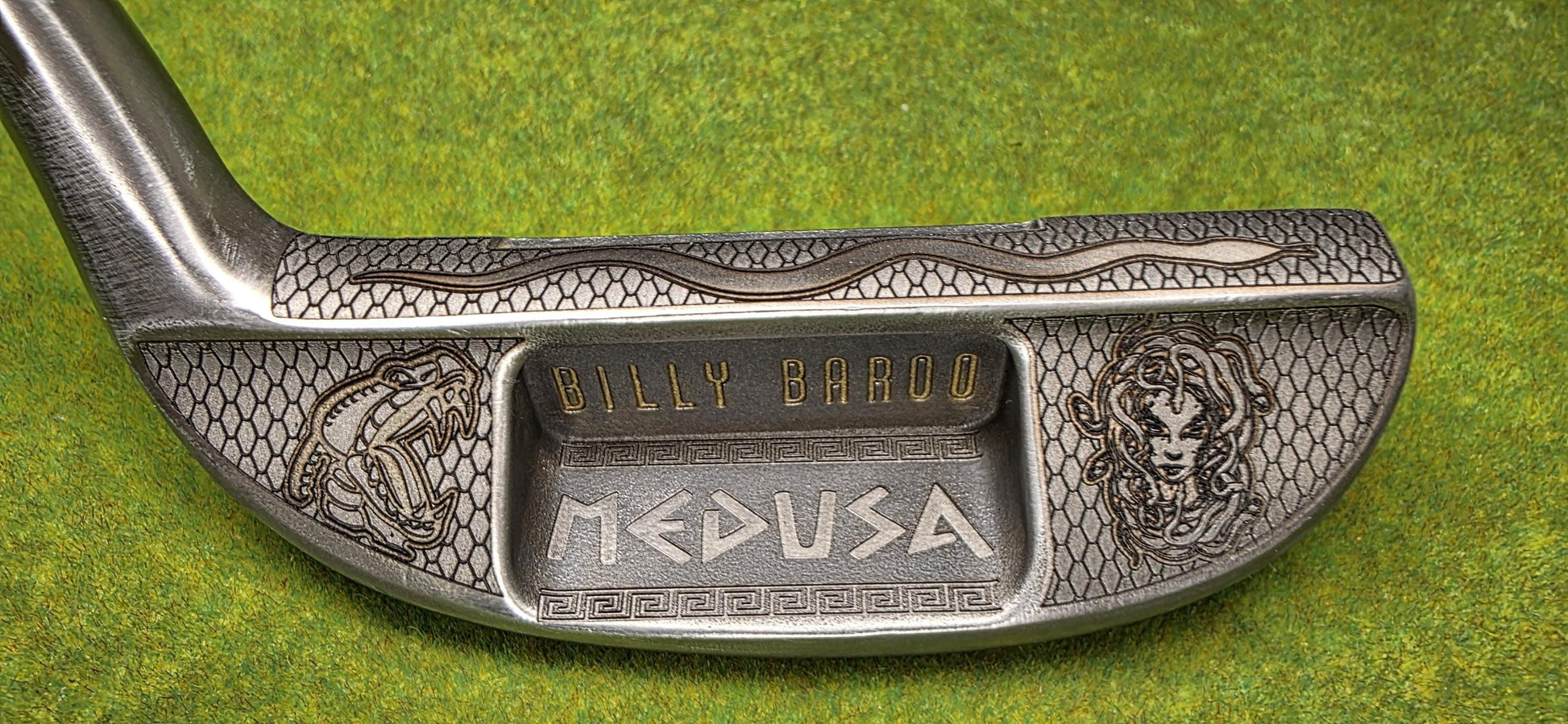 Medusa-inspired engraved Ray Cook Billy Baroo putter with serpent scales, snake engraving, and detailed Medusa face design. Unique mythology-themed golf club that can be played or displayed as a collector’s piece. Custom laser engraved putter ideal for golf enthusiasts, mythology fans, and collectors. Perfect gift for Father’s Day, groomsmen, birthdays, or golf lovers who want a one-of-a-kind club with both style and attitude. medusa golf putter ray cook billy baroo engraved golf putter