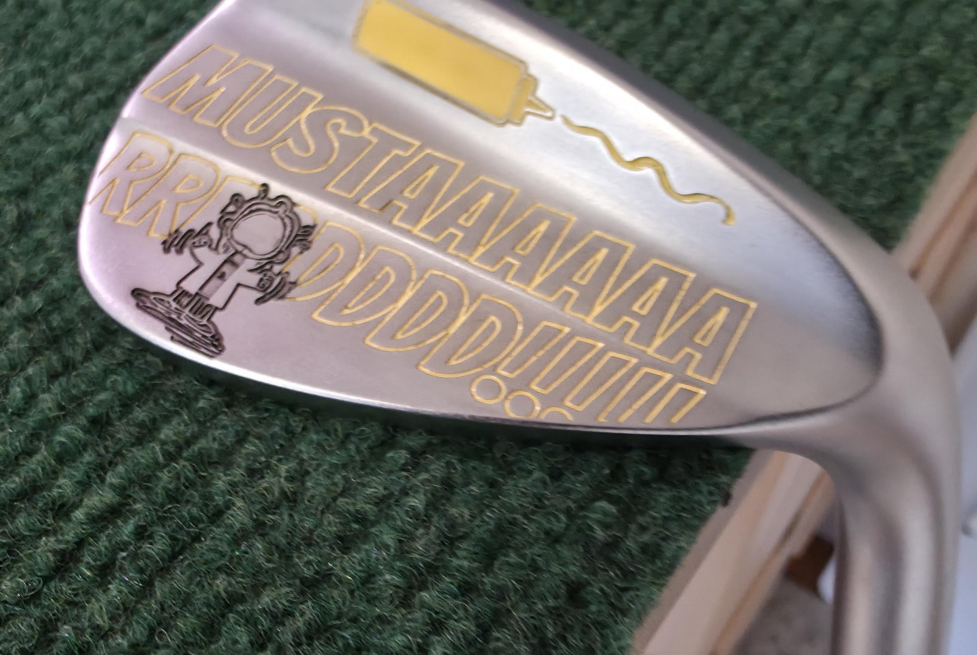 Custom “Mustard” engraved 56-degree golf wedge featuring yellow laser engraving with a mustard bottle and bold “MUSTAAAARRRDD!!!” text. Funny personalized golf club for golfers, collectors, and gift giving. Perfect for Father’s Day, birthdays, or groomsmen. Durable steel wedge designed for both play and laughs, combining humor, performance, and unique custom engraving that stands out on the course.
