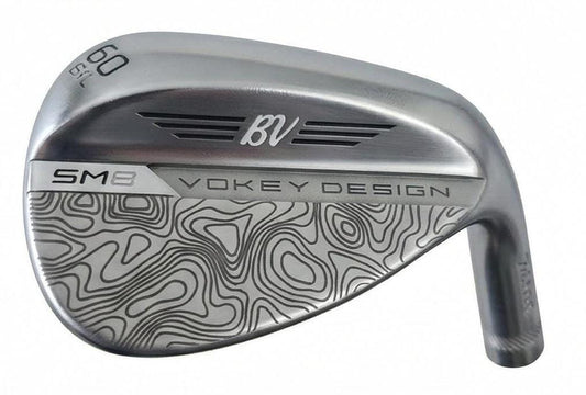 Custom laser-engraved Titleist Vokey SM8 golf wedge by Par Bros Golf, featuring a detailed, wrap-around topographic map pattern. The intricate artisan etching covers the steel clubhead, highlighting unique personalized craftsmanship. Titleist Vokey Design SM8 wedge with deep, intricate topographic map-style laser engraving covering the clubhead's surface. The 'BV' logo, 'SM8', and 'VOKEY DESIGN' markings are clearly visible on the brushed steel finish.