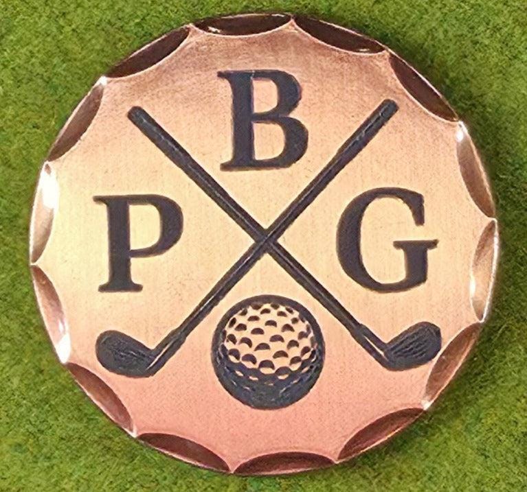 Golf-themed metal badge with 'PBG' initials on a green grass background