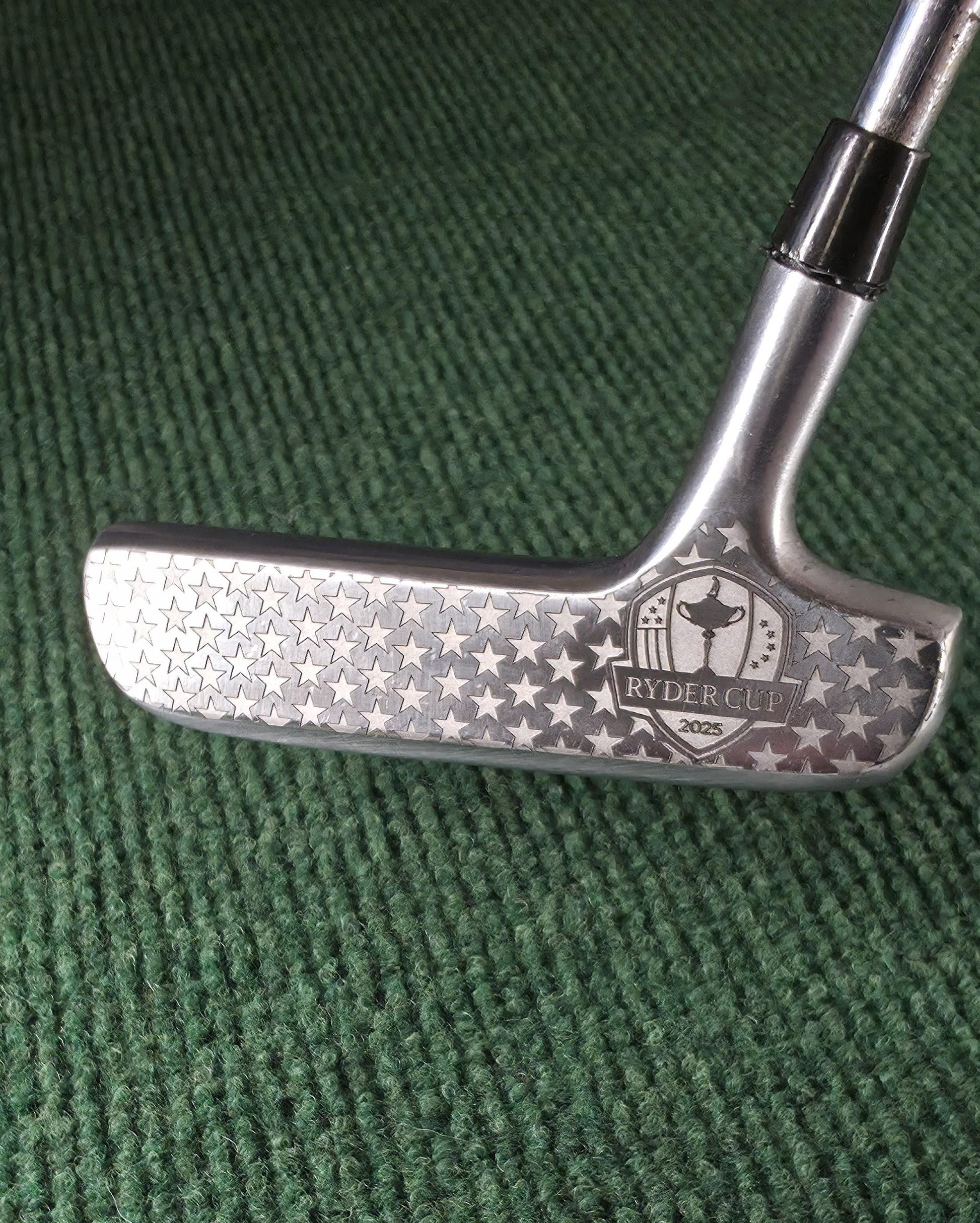 Custom engraved Spalding Cash-In putter inspired by the 2025 Ryder Cup. Features stars, eagle crest, and repeating Ryder Cup text pattern. Vintage-style engraved golf putter for collectors, players, and gift-giving. Perfect for Ryder Cup fans, golf history enthusiasts, or as a personalized golf gift. Durable steel putter head with laser engraving, combining artistry and performance in a one-of-a-kind golf collectible ryder cup putter spalding golf putter engraved golf club custom golf putter